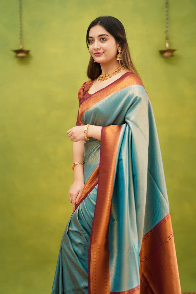 Prodigal Firozi Soft Banarasi Silk Saree With Demure Blouse Piece