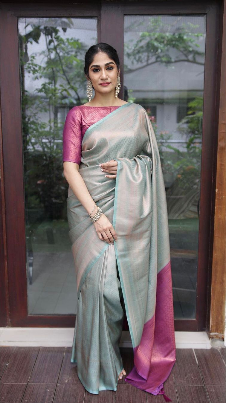 Effulgent Sea Green Soft Silk Saree with Super Ornate Blouse Piece