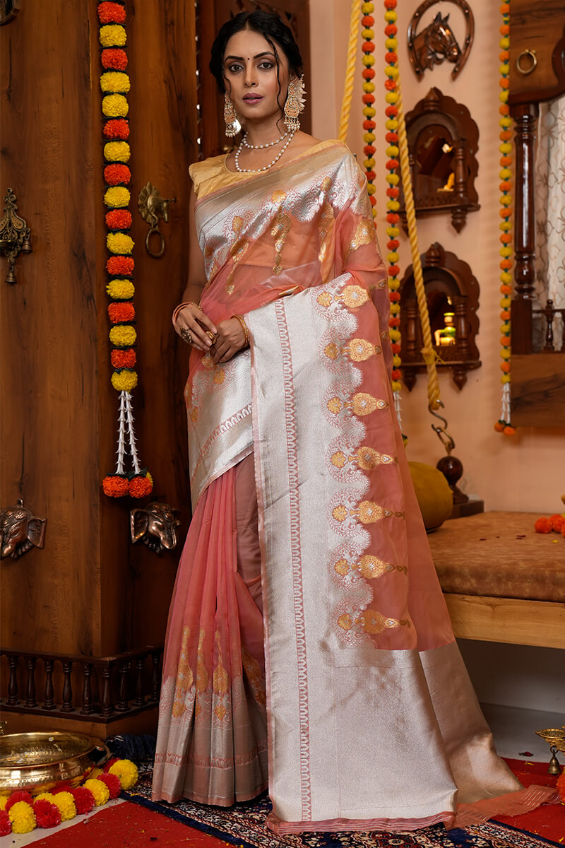 Cynosure Peach Organza Silk Saree With Pulsating Blouse Piece