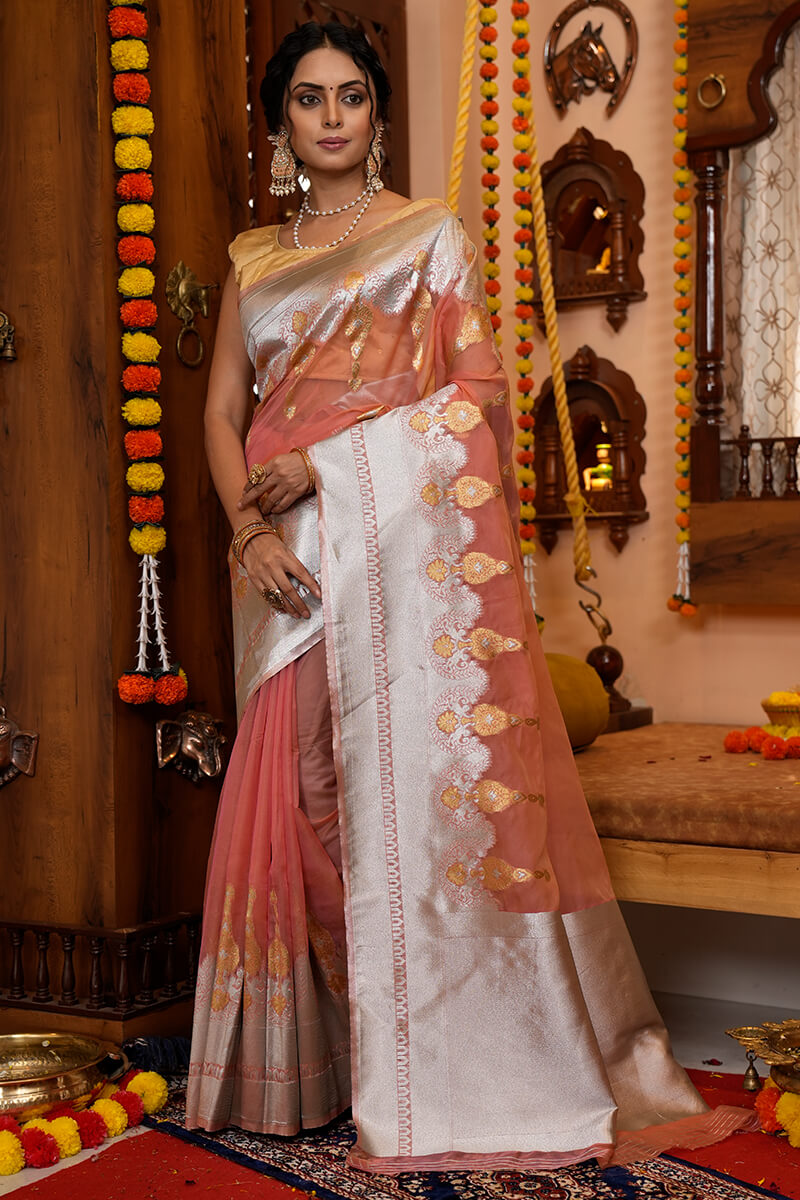 Cynosure Peach Organza Silk Saree With Pulsating Blouse Piece