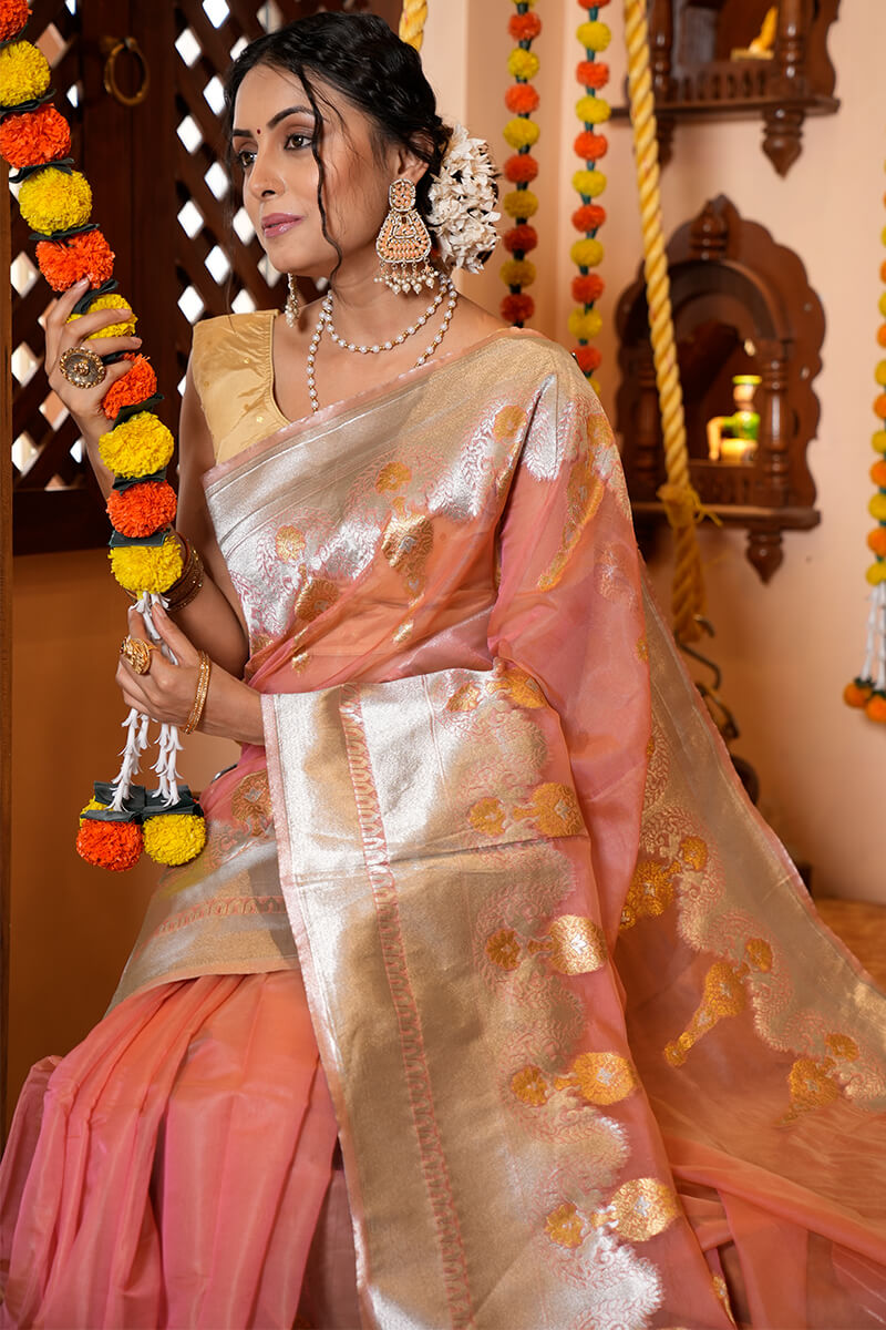 Cynosure Peach Organza Silk Saree With Pulsating Blouse Piece