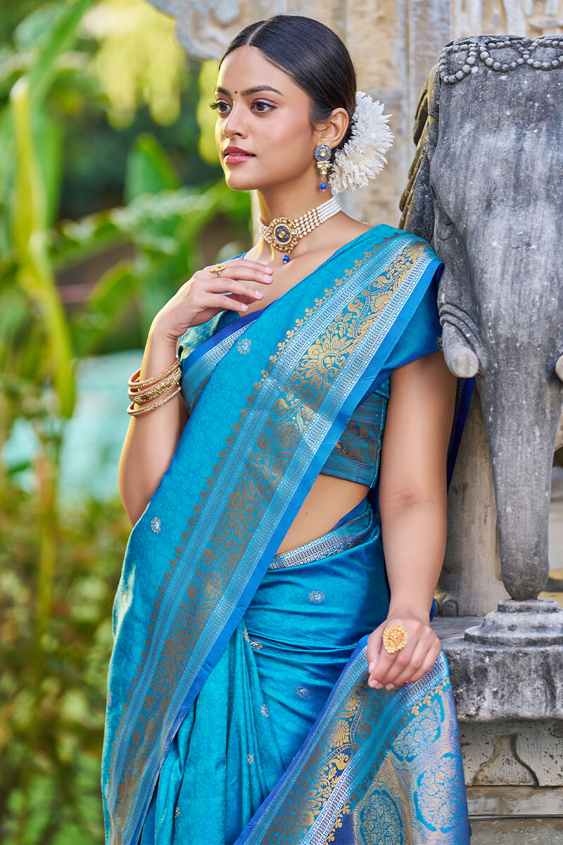 Desiring Firozi Kanjivaram Silk Saree With Serendipity Blouse Piece