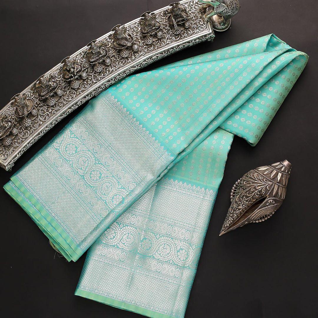 Engrossing Firozi Soft Silk Saree With Incomparable Blouse Piece