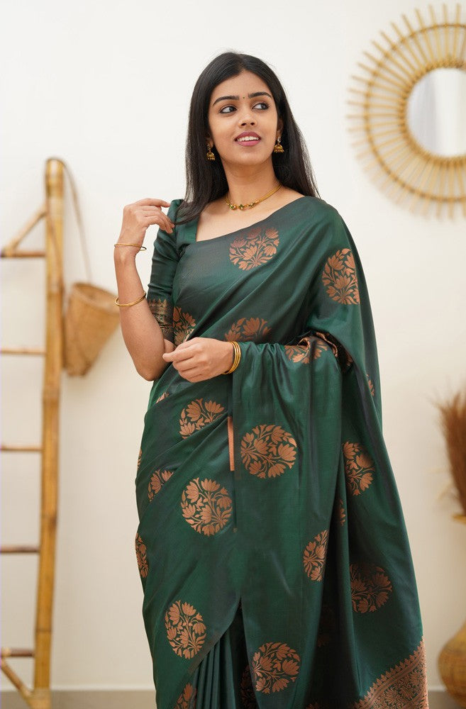 A dreamy Dark Green Soft Silk Saree With Adorable Blouse Piece