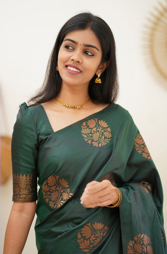 A dreamy Dark Green Soft Silk Saree With Adorable Blouse Piece