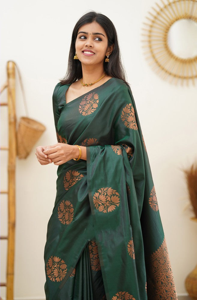 A dreamy Dark Green Soft Silk Saree With Adorable Blouse Piece