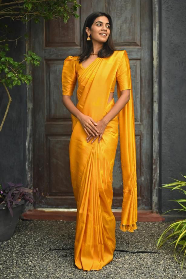 Lustrous Yellow Soft Silk Saree With Vestigial Blouse Piece