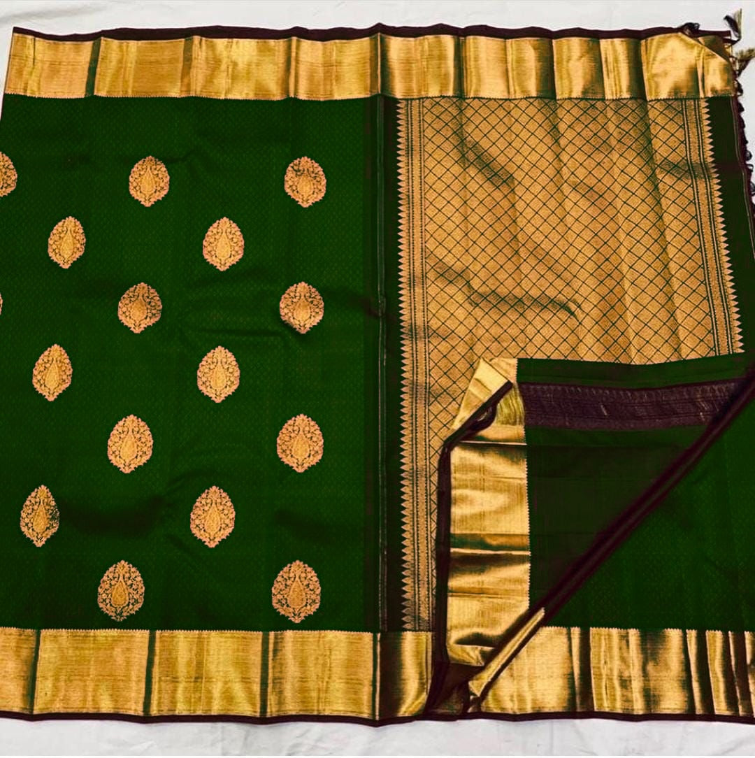 Elaborate Dark Green Soft Silk Saree With Nectarous Blouse Piece