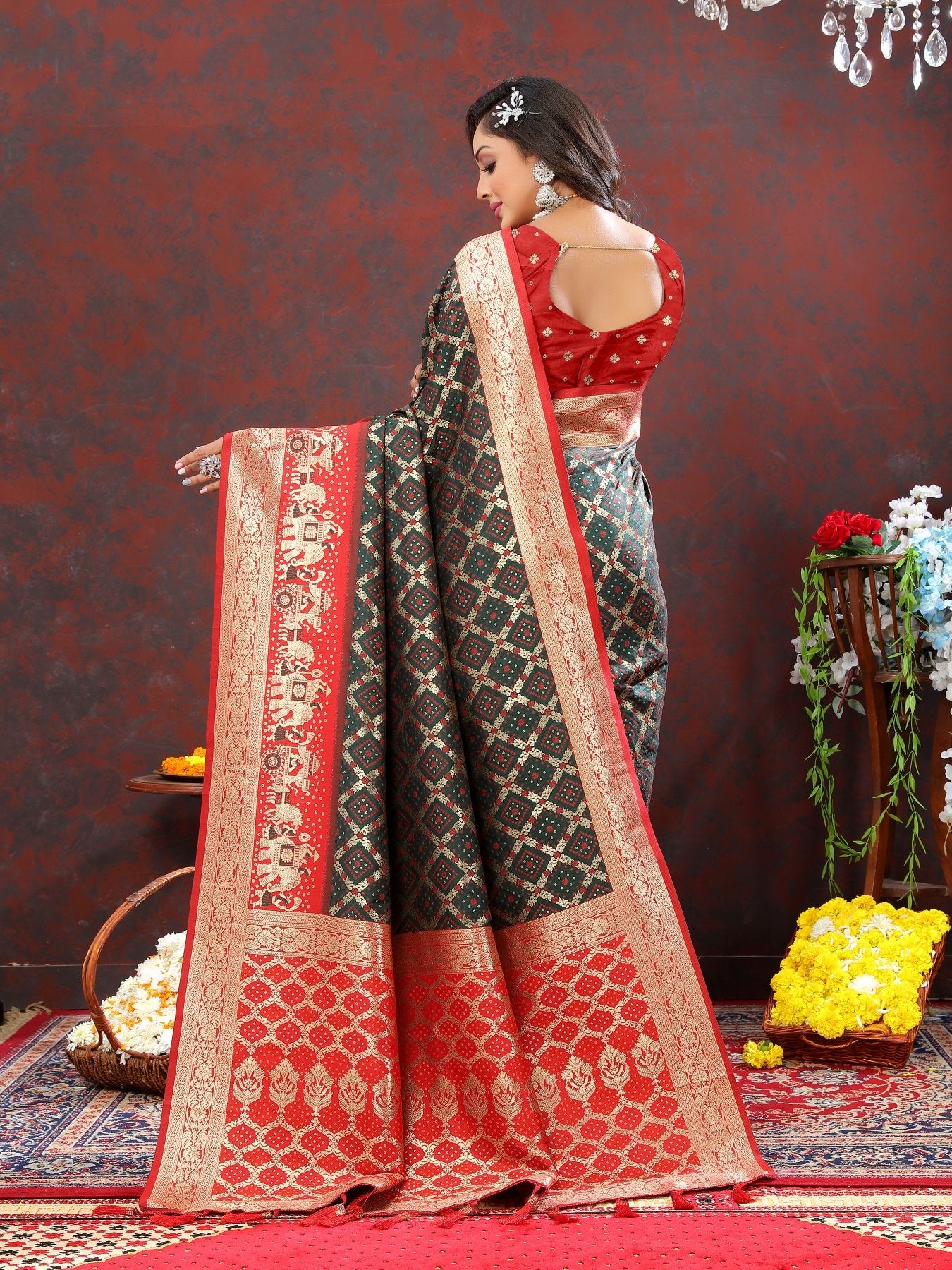 Glorious Dark Green Patola Silk Saree with Vibrant Blouse Piece