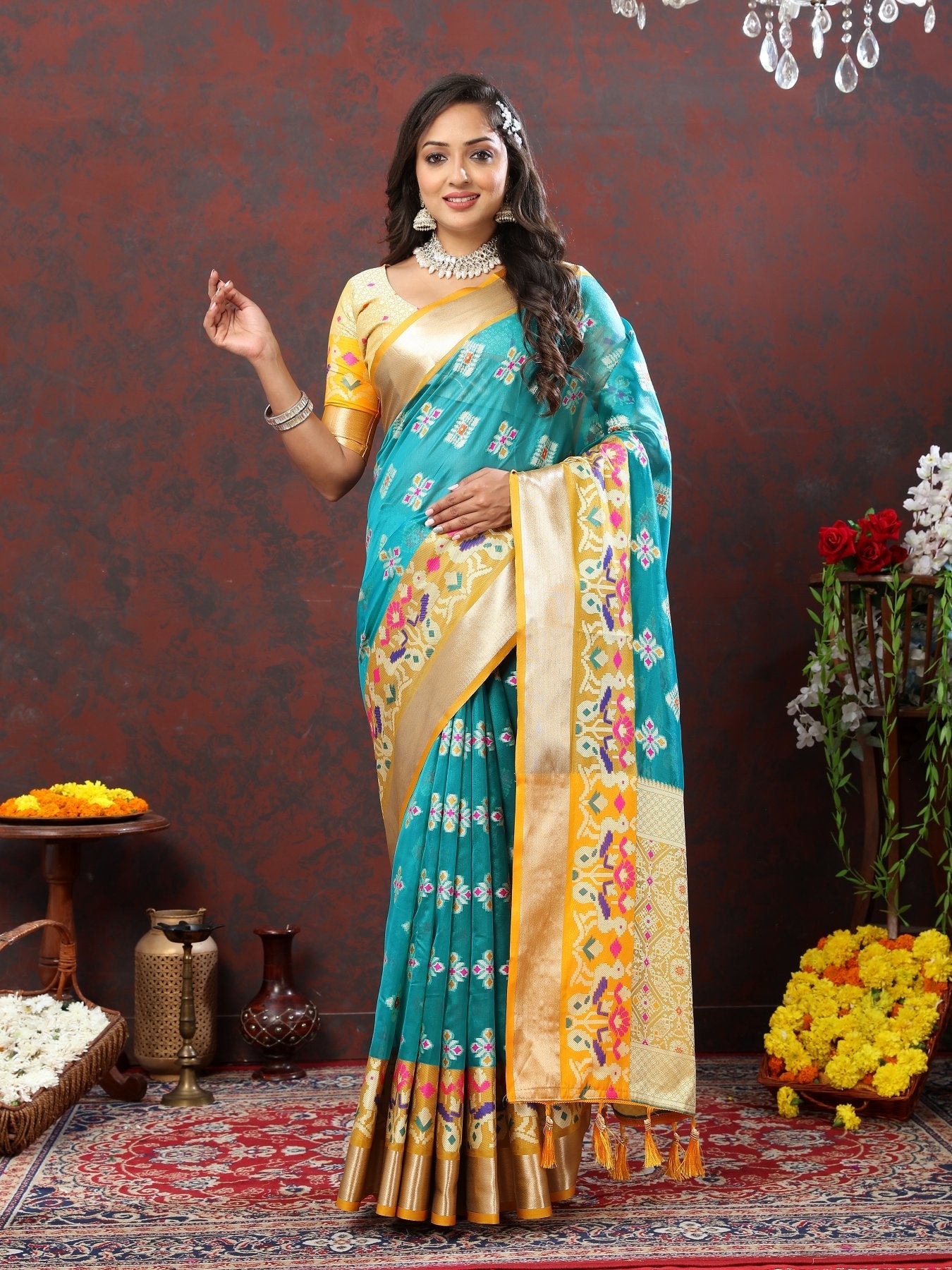 A dreamy Firozi Organza Silk Saree With Exuberant Blouse Piece