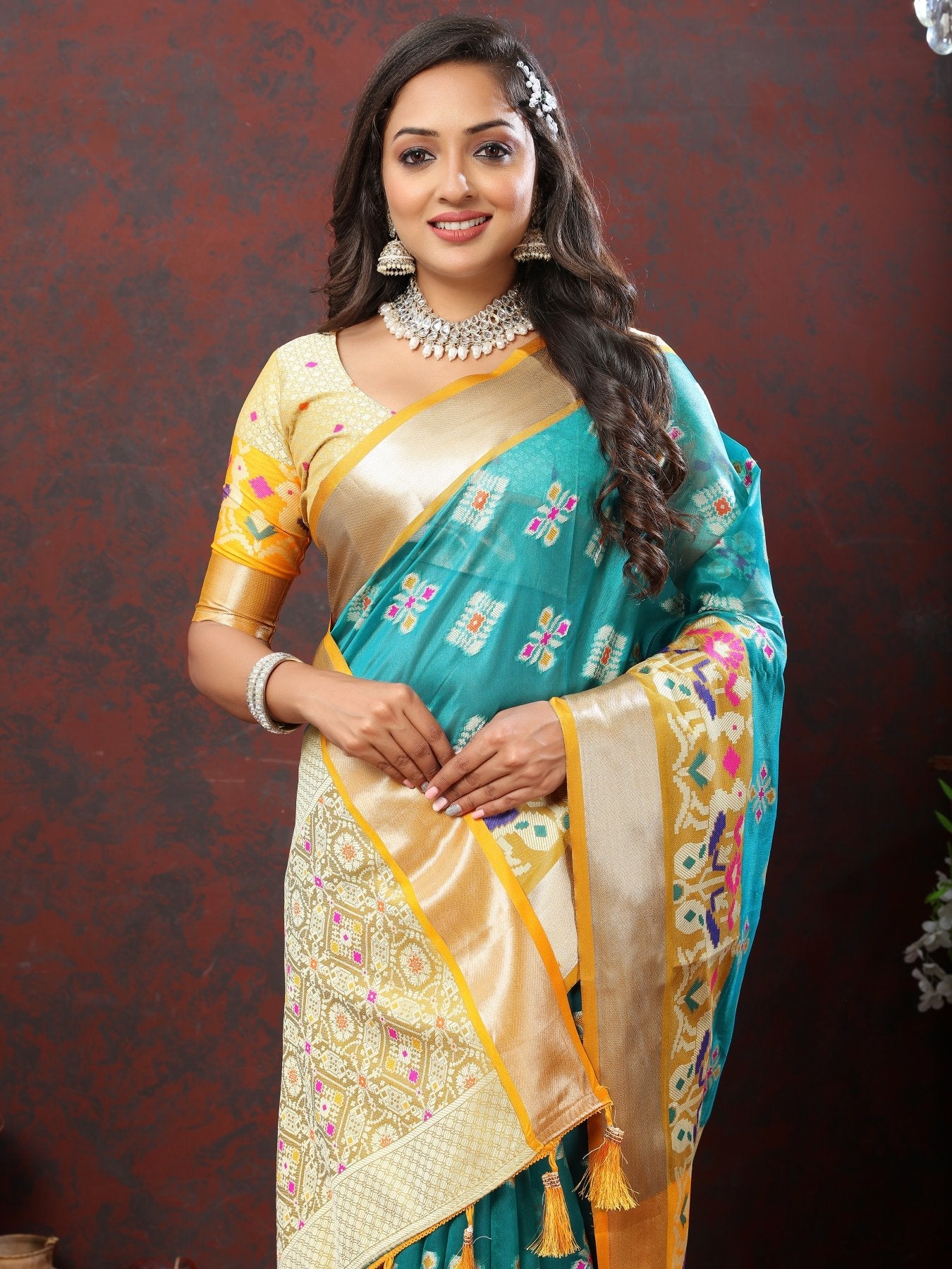 A dreamy Firozi Organza Silk Saree With Exuberant Blouse Piece