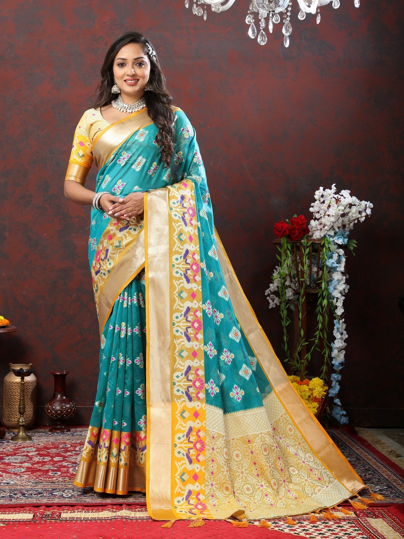 A dreamy Firozi Organza Silk Saree With Exuberant Blouse Piece