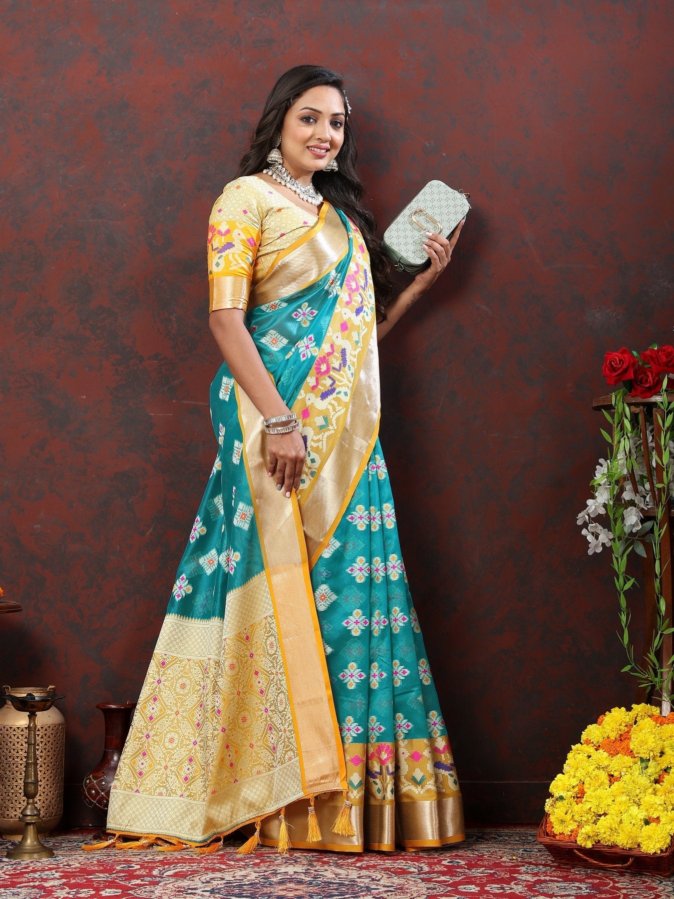 A dreamy Firozi Organza Silk Saree With Exuberant Blouse Piece