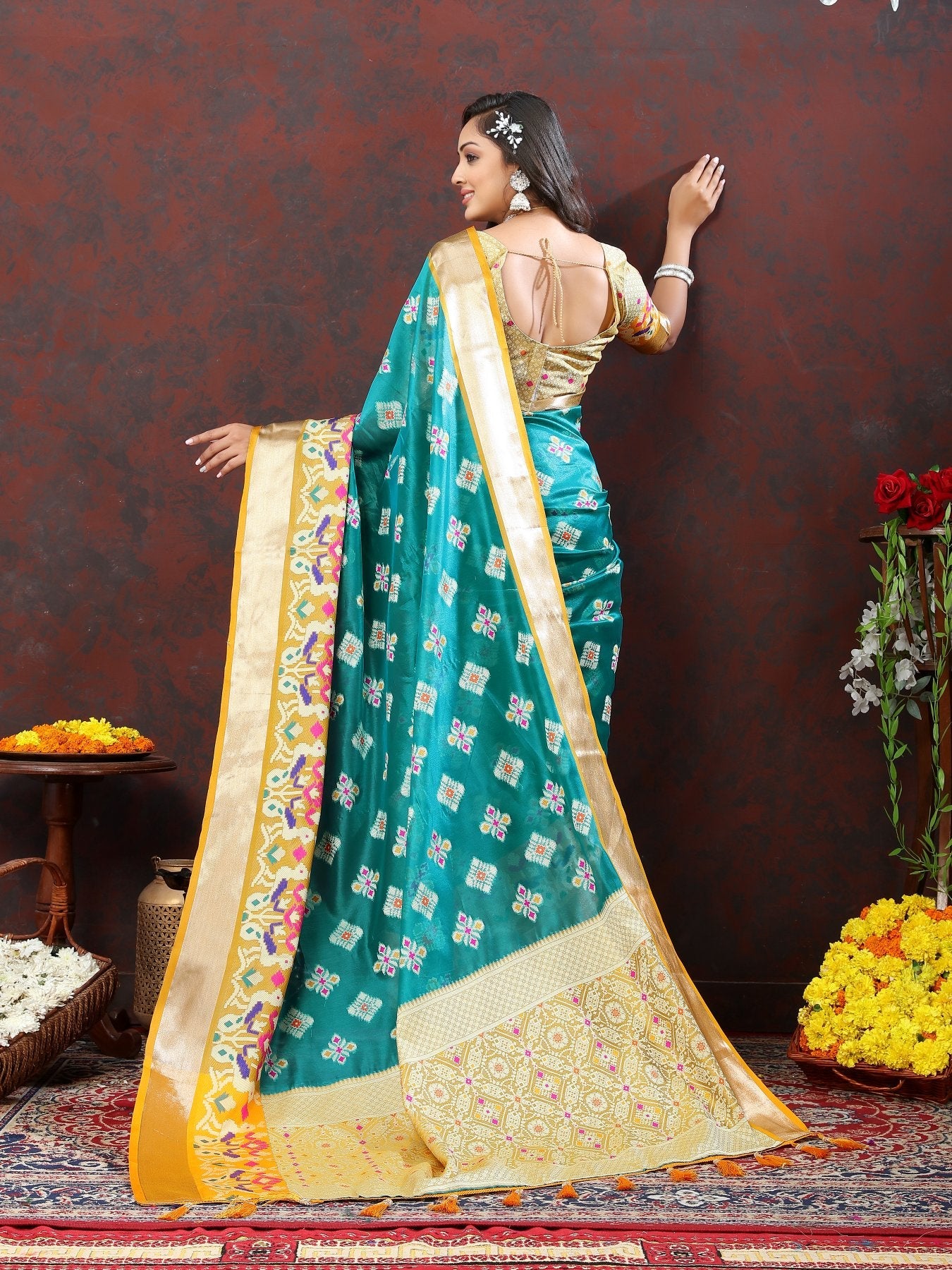 A dreamy Firozi Organza Silk Saree With Exuberant Blouse Piece