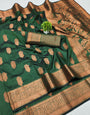 Petrichor Dark Green Soft Banarasi Silk Saree With Super extravagant Blouse Piece