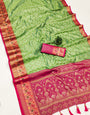 Cynosure Green Soft Banarasi Silk Saree With Gossamer Blouse Piece