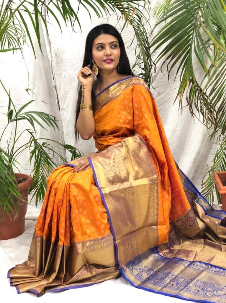 Artistic Orange Banarasi Silk Saree With Prominent Blouse Piece