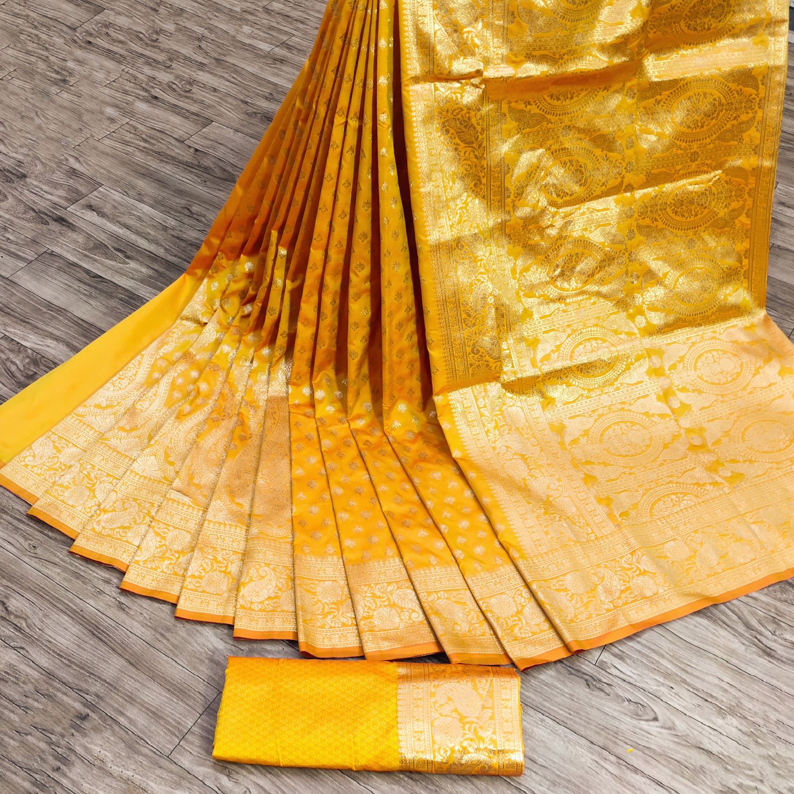 Cynosure Stunning Yellow Banarasi Silk Saree With Divine Blouse Piece