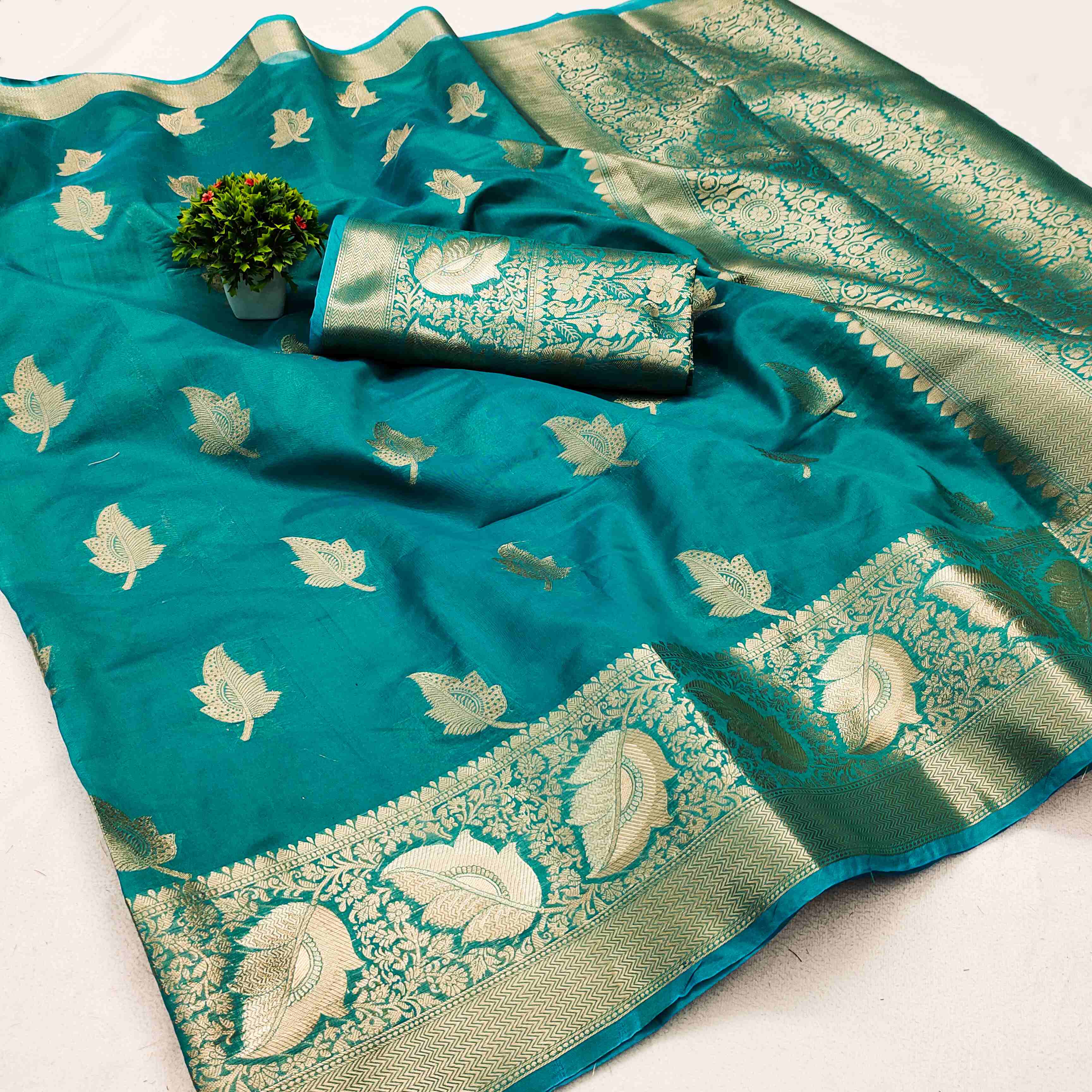 Mellifluous Firozi Organza Silk Saree With Beguiling Blouse Piece