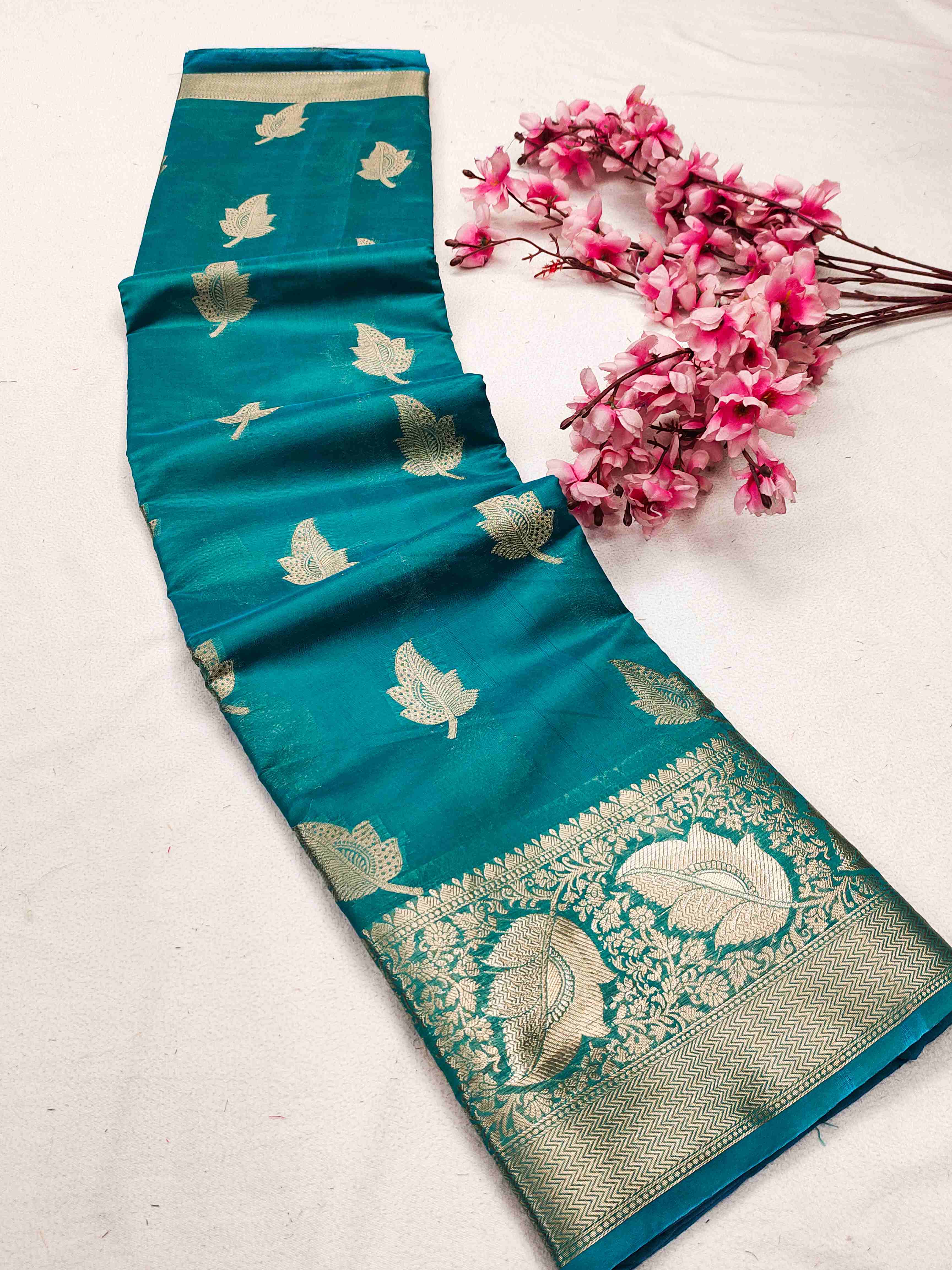 Mellifluous Firozi Organza Silk Saree With Beguiling Blouse Piece