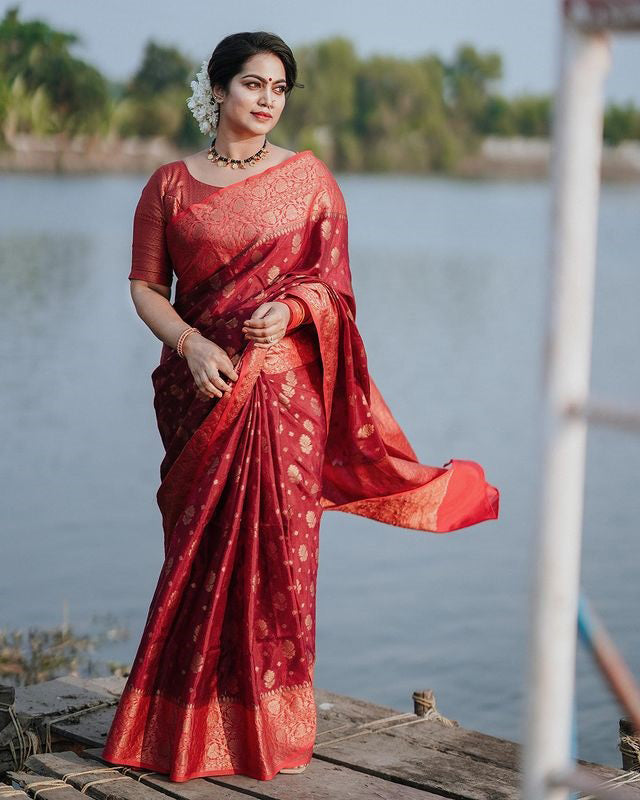 Delightful Red Soft Silk Saree With Cynosure Blouse Piece