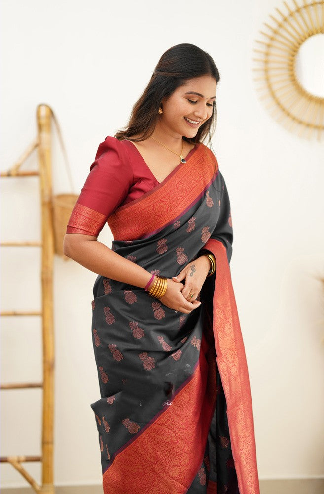 Hypnotic Black Soft Silk Saree With Snazzy Blouse Piece